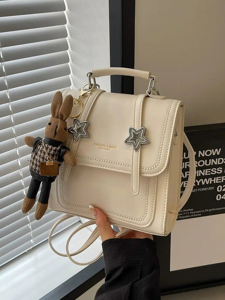 Star Accents Compact Leather Backpack