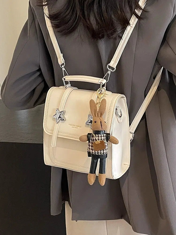 Star Accents Compact Leather Backpack