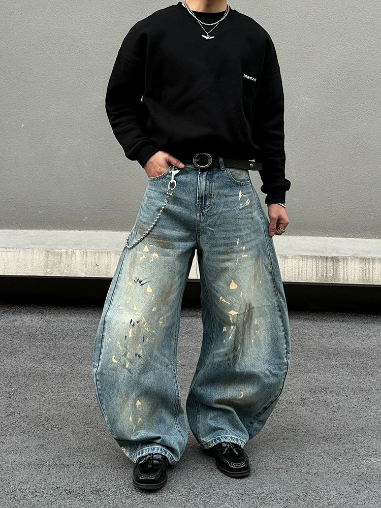 Distressed brede ben jeans med sprøjt