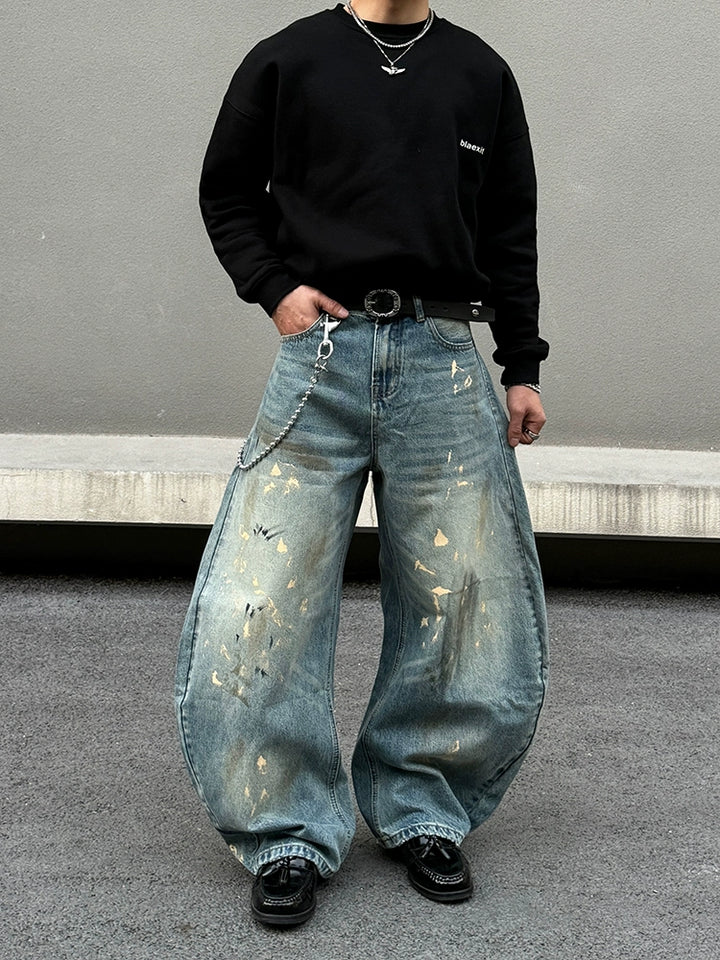 Distressed brede ben jeans med sprøjt