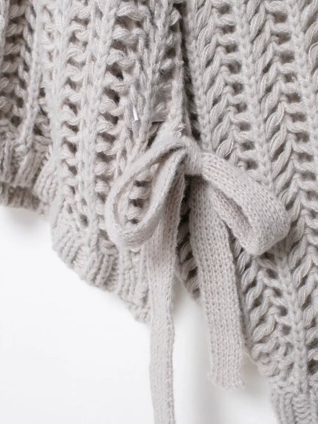 سُترة طويلة الأكمام مع حزام جانبي محبوك