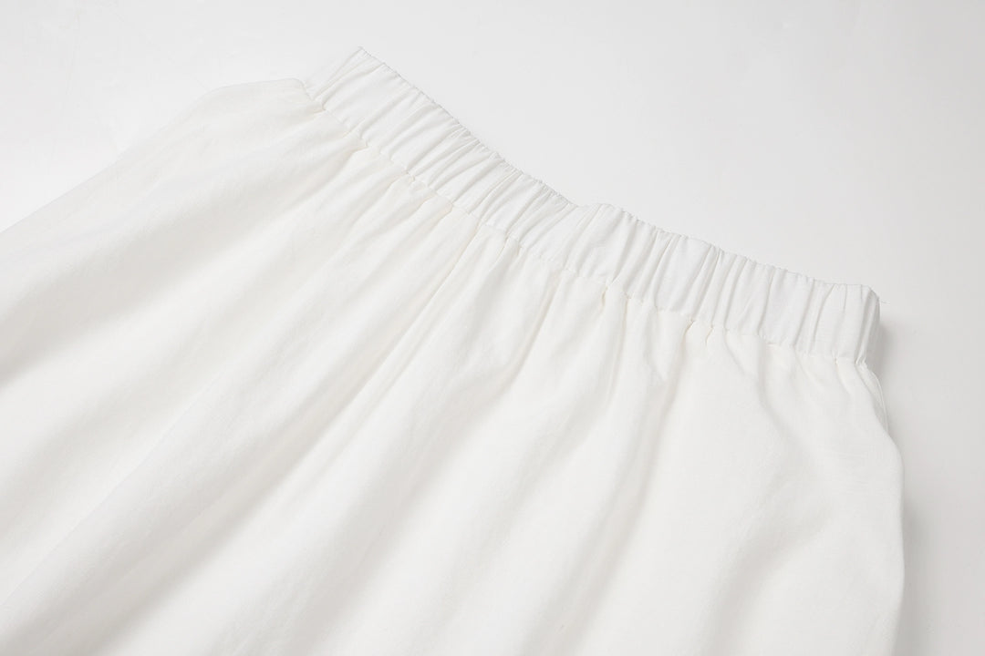 طقم من قطعتين: بلوزة بلا أكمام وتنورة