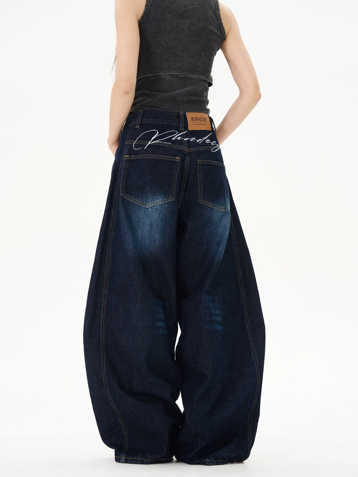 Wide-Leg Scimitar Jeans Pants