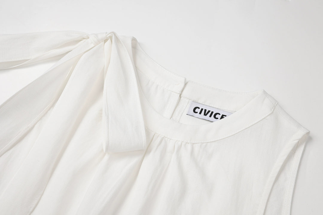 طقم من قطعتين: بلوزة بلا أكمام وتنورة