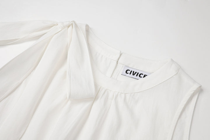 طقم من قطعتين: بلوزة بلا أكمام وتنورة