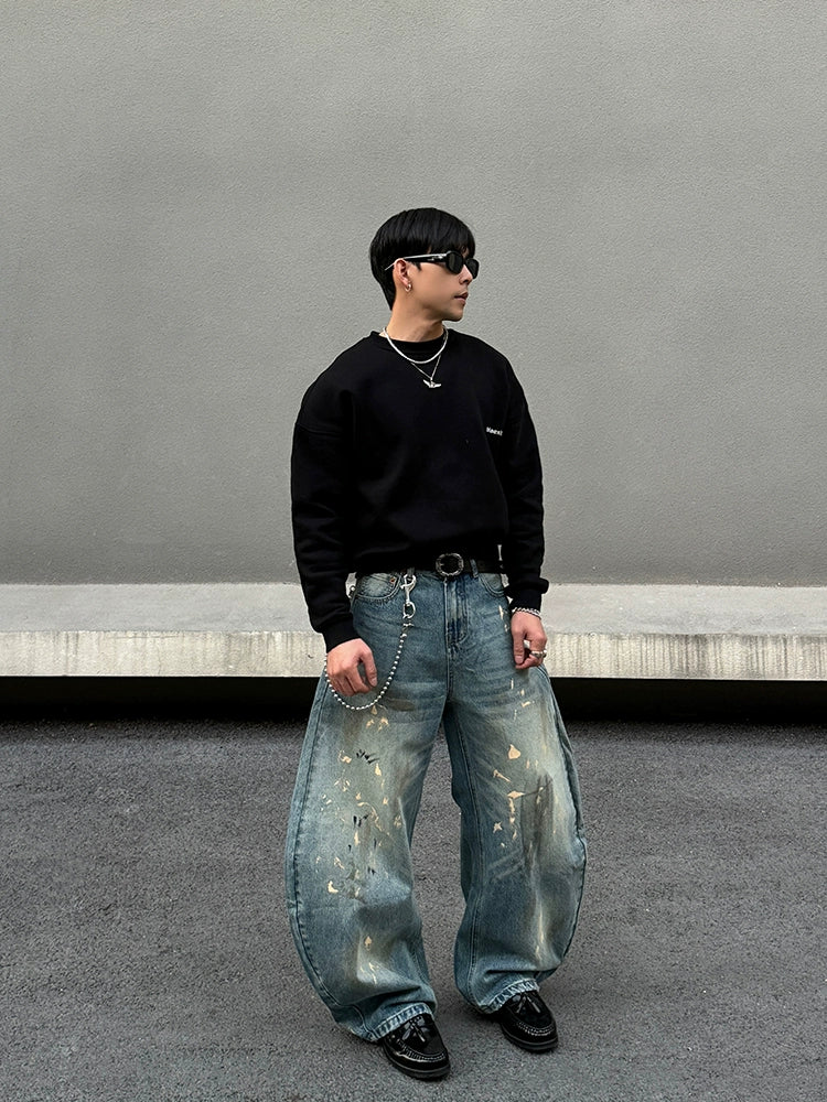 Distressed brede ben jeans med sprøjt