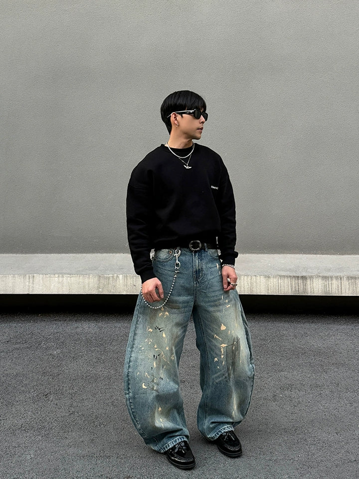 Distressed brede ben jeans med sprøjt