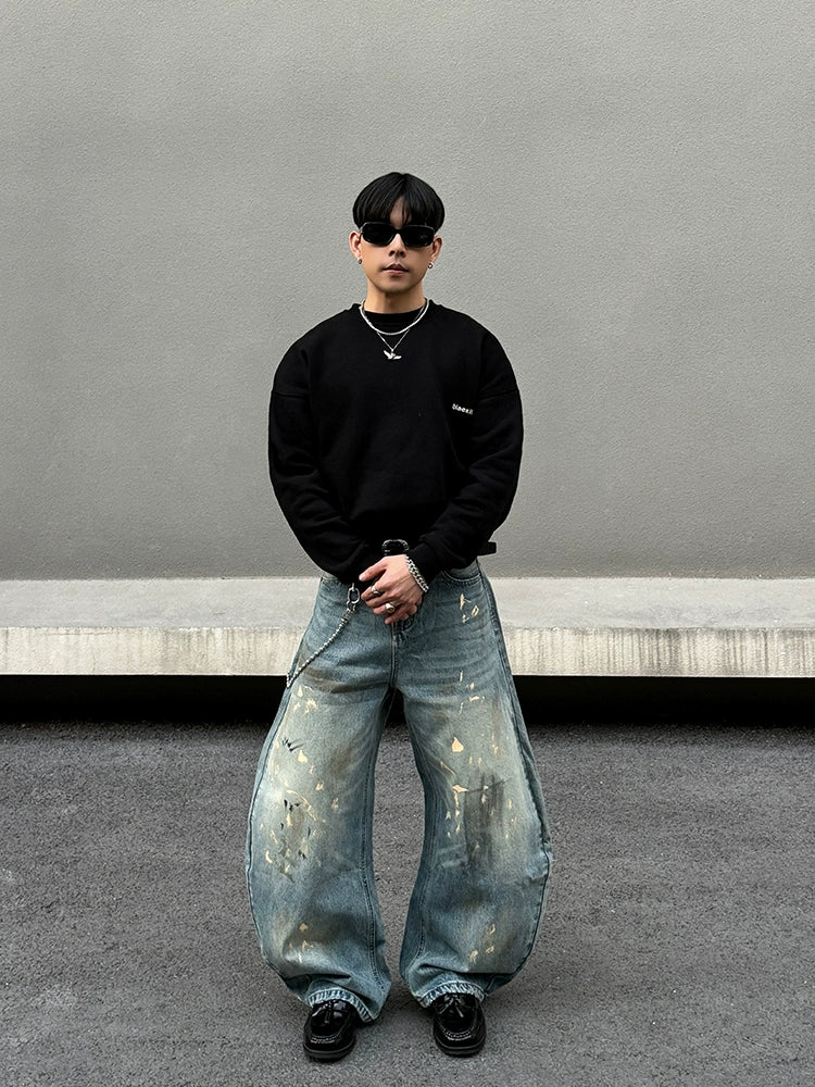 Distressed brede ben jeans med sprøjt