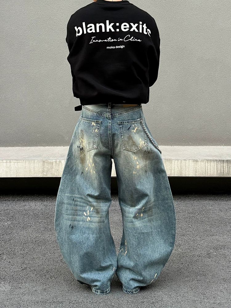 Distressed brede ben jeans med sprøjt