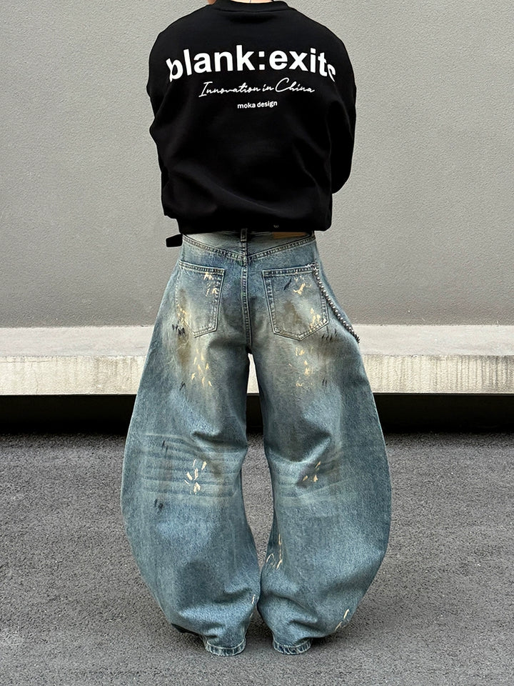 Distressed brede ben jeans med sprøjt