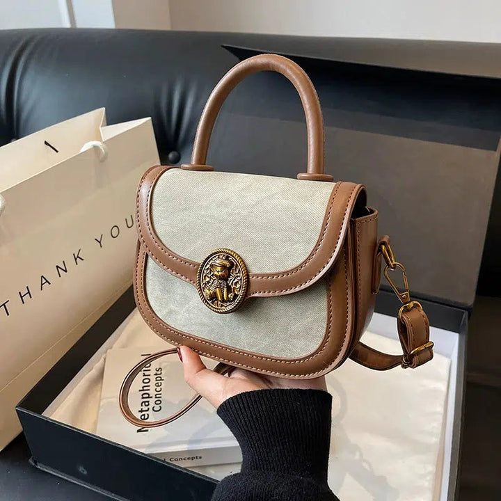 Lion Emblem Leather Crossbody Handbag
