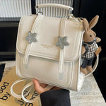 Star Accents Compact Leather Backpack