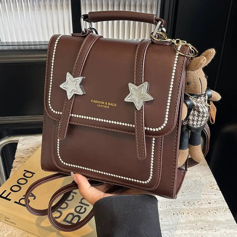 Star Accents Compact Leather Backpack