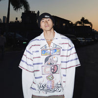 Chemise polo à rayures imprimé graffiti à superposition factice 