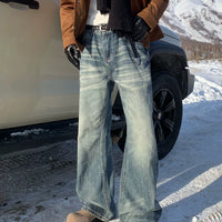 جينز مستقيم الساق بتصميم قديم متآكل 