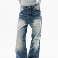 جينز واسع الساق بتصميم متهالك ومغسول بشكل عتيق 