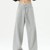 بنطلون رياضي بخصر مطاطي وساق واسع 