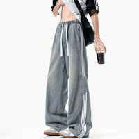 بنطال جينز بساق واسعة مع ثلاثة خطوط وحزام سحب 