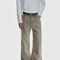 بنطلونات جينز واسعة الساق مع حواف منحنية 