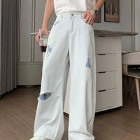 Gerissene lockere Schlagjeans 