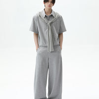 طقم بلوزة مخططة وبنطلون واسع الساق 