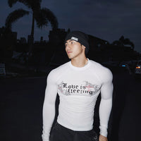 تي شيرت رياضي بأكمام طويلة وقصة ضيقة 