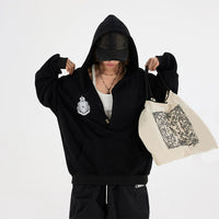 Sudadera con media cremallera y botones bordados 