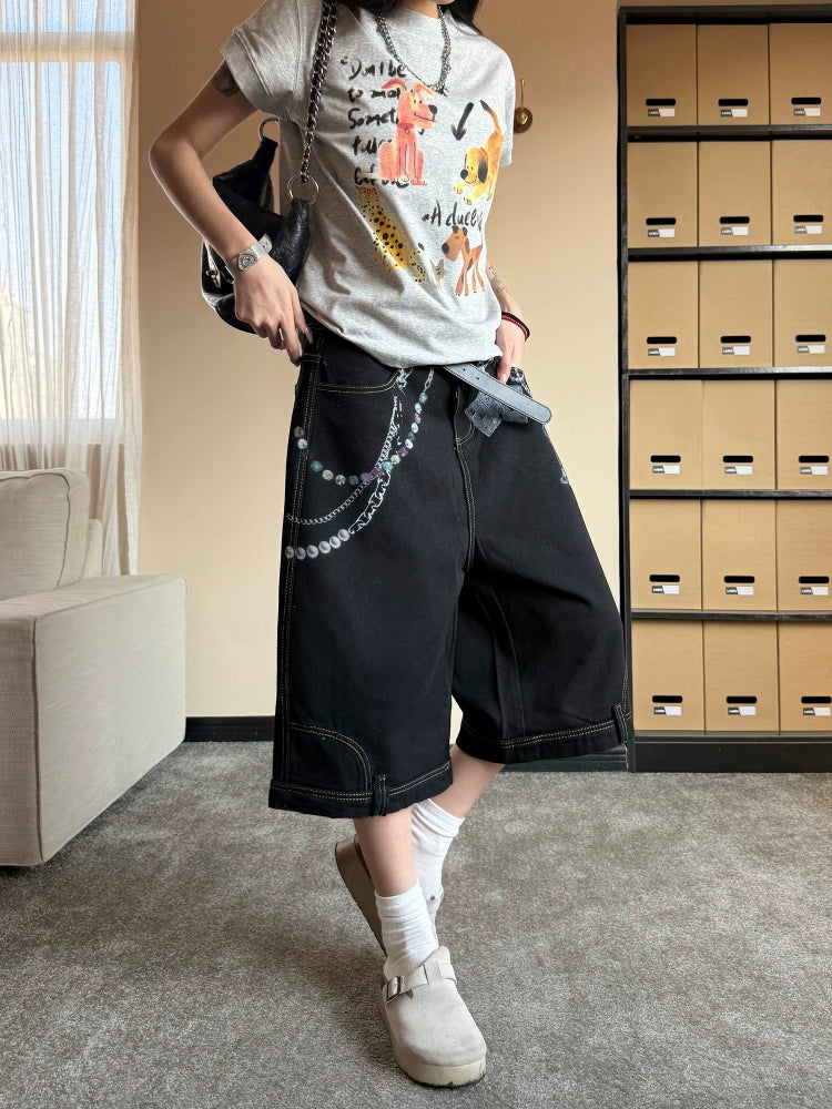 Pantaloni cropped in denim con stampa a catena 