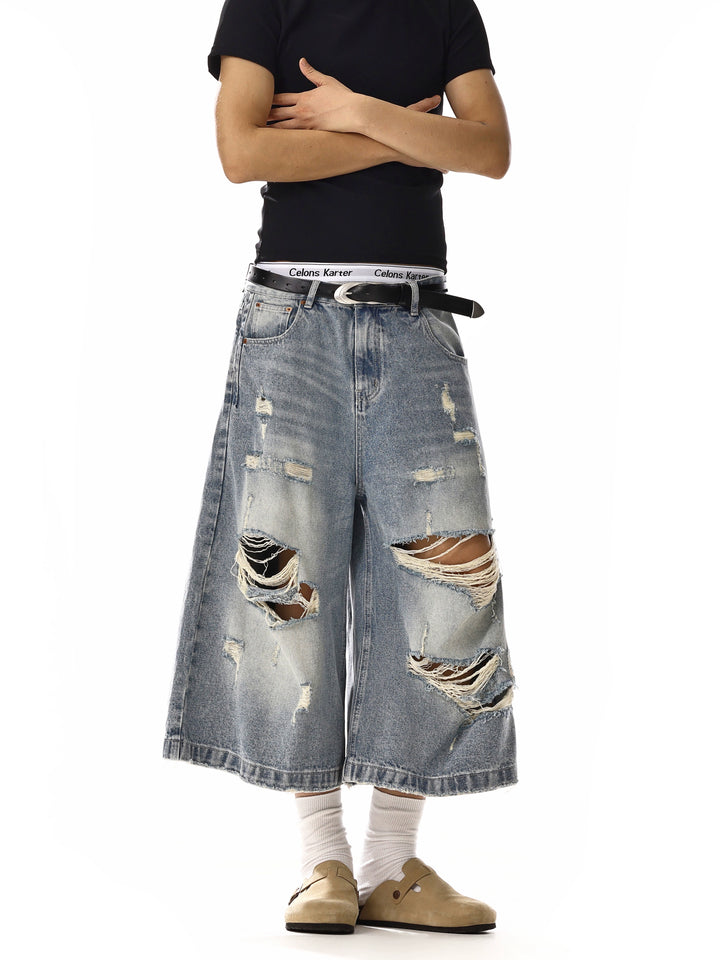 Calças de Denim Cropped Largas Rasgadas 