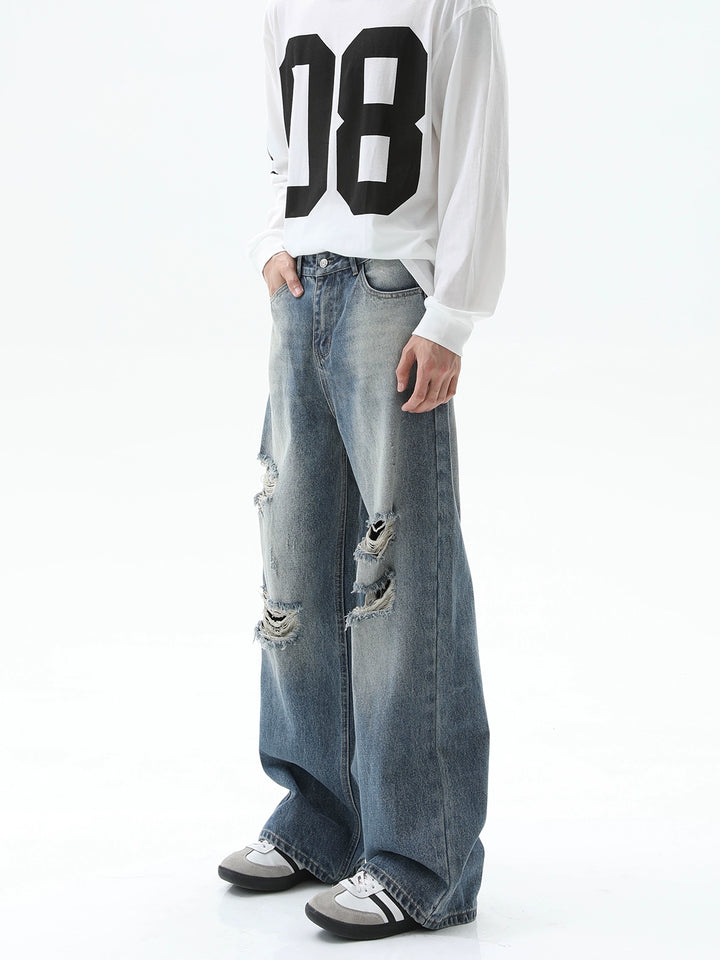 Jeans larges déchirés à taille haute 