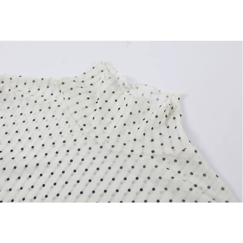 Polka Dot Ruffled Hem Turtleneck Top