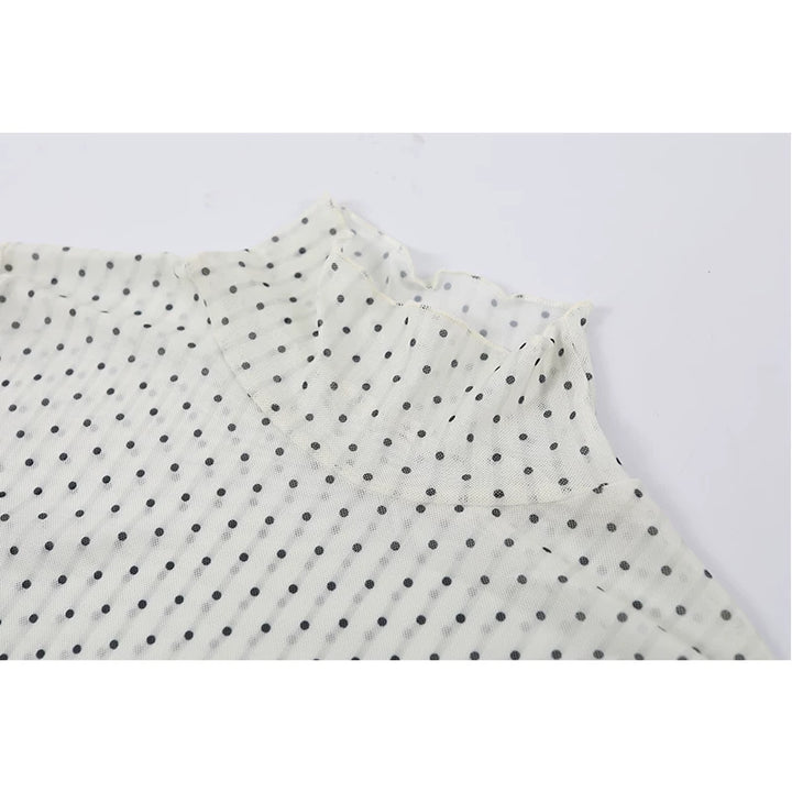 Polka Dot Ruffled Hem Turtleneck Top