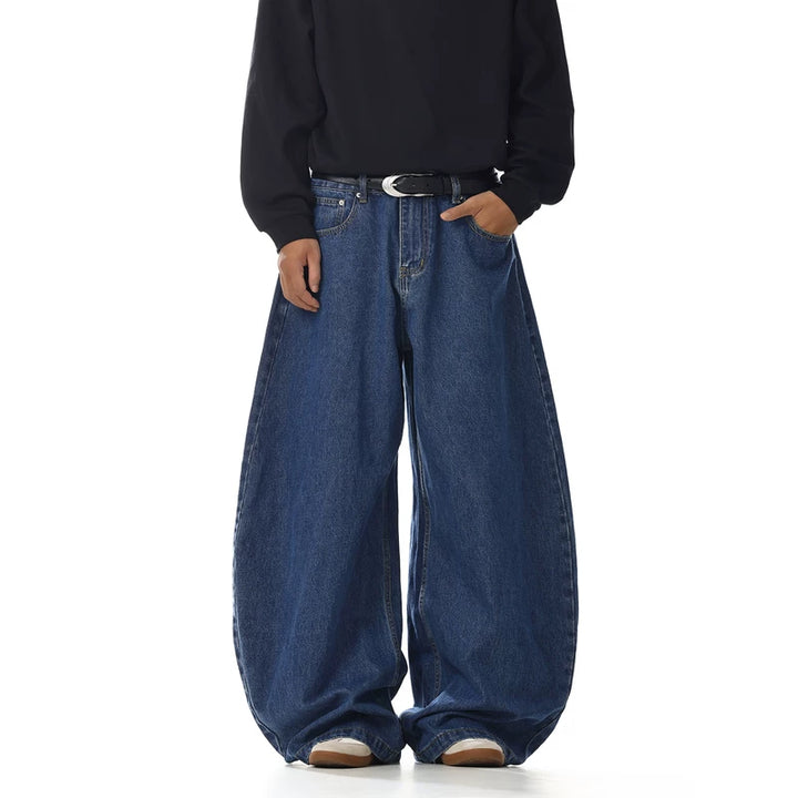 Pantaloni in jeans con gamba larga e lama curva 