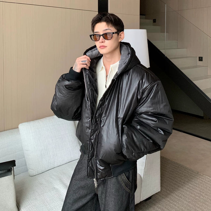Glanzende PU-lederen gewatteerde jas met capuchon 