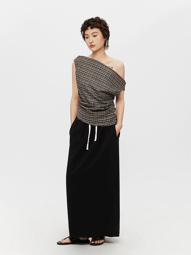 Pull col roulé ajusté à une épaule en tartan 
