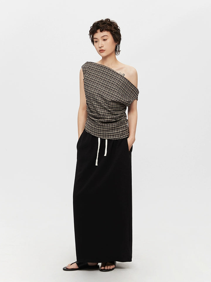 Pull col roulé ajusté à une épaule en tartan 