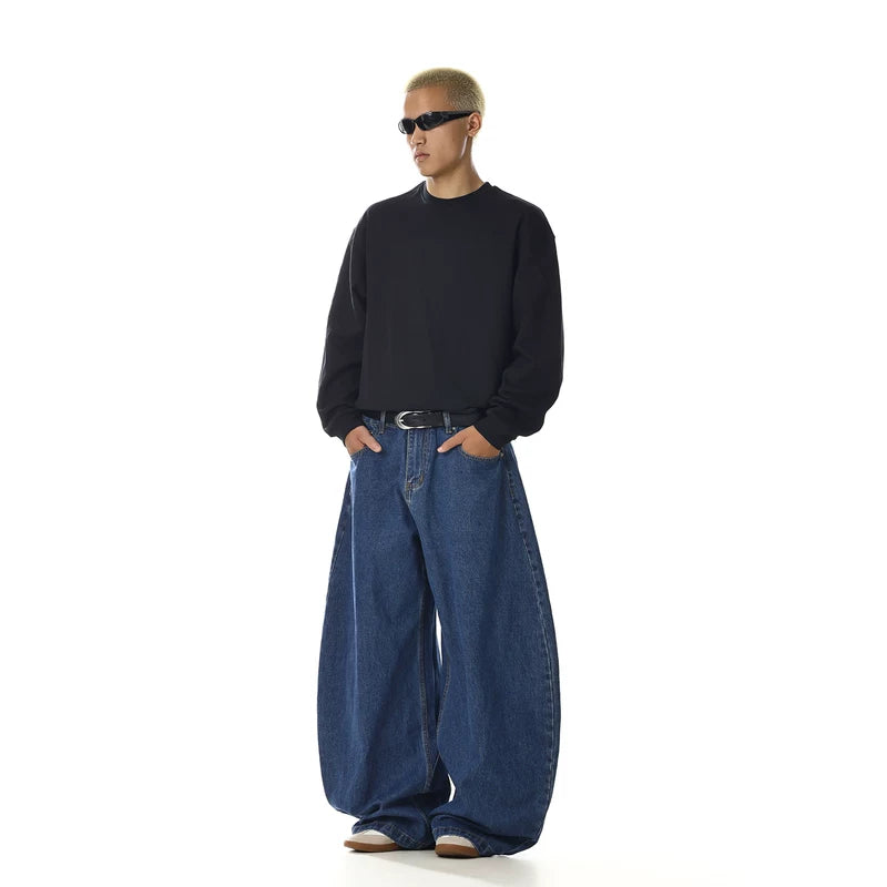 Pantaloni in jeans con gamba larga e lama curva 