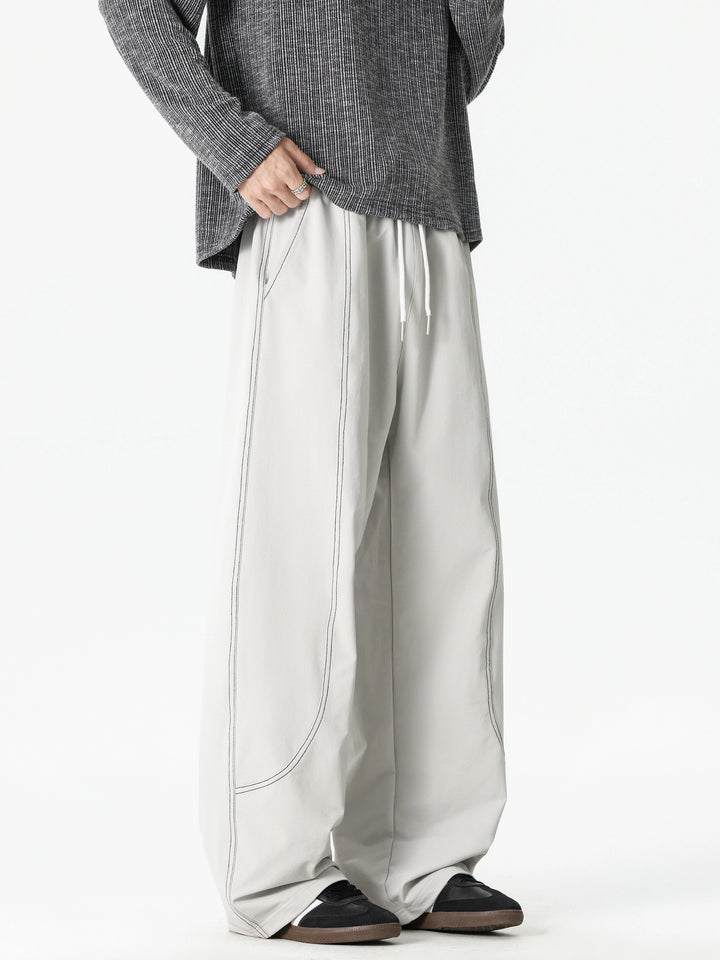 Pantaloni casual a gamba larga con cuciture deconstruite 