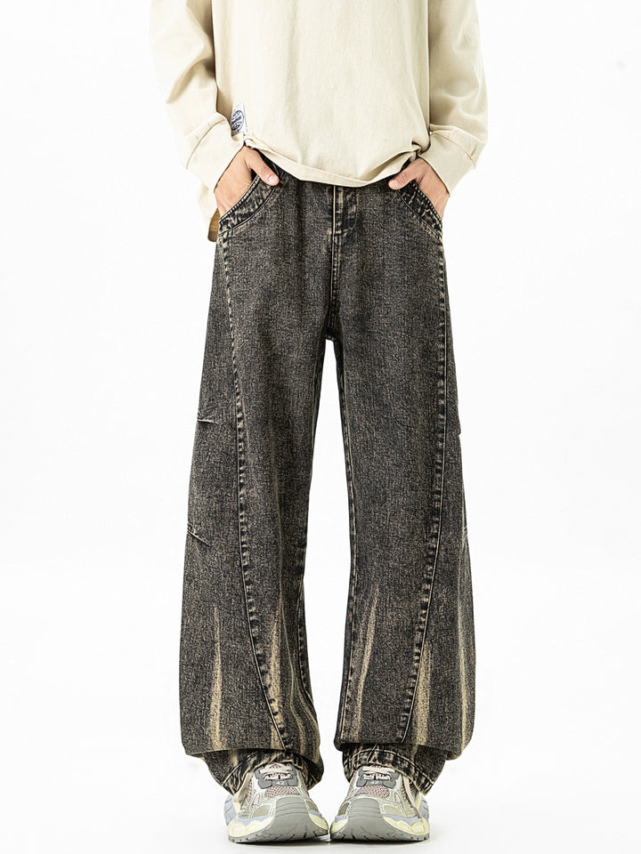 Pantalones de mezclilla deconstruidos de pierna ancha y lavados 