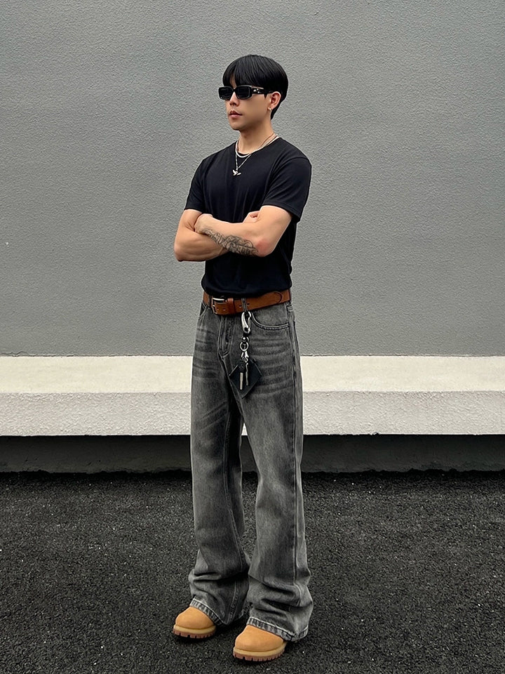 Jeans rectos acampanados desgastados 
