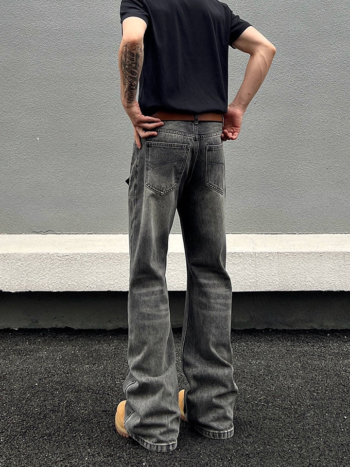 Jeans rectos acampanados desgastados 