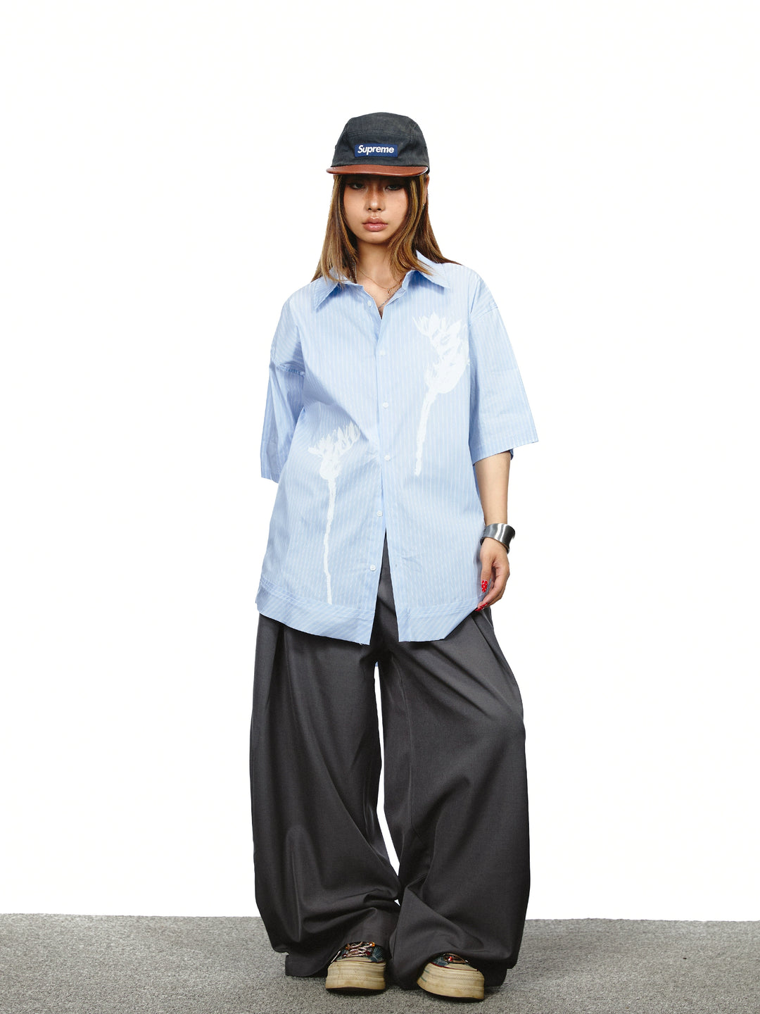 Pantaloni a gamba larga con vita alta plissettata 