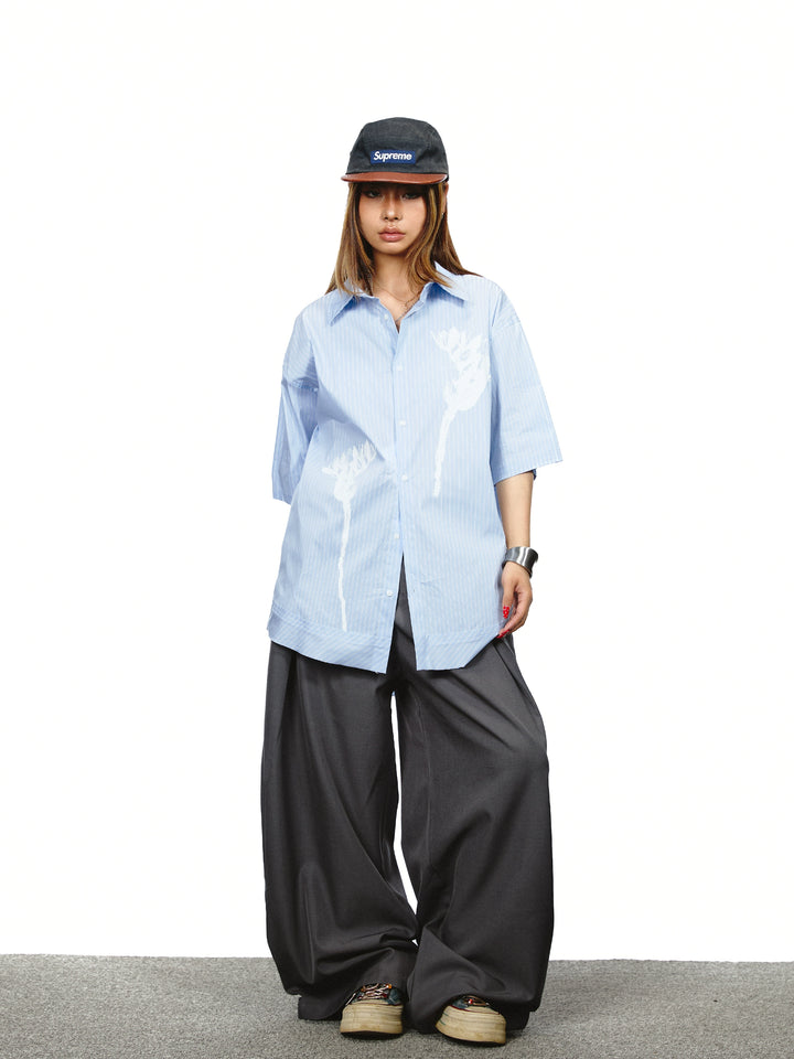 Pantaloni a gamba larga con vita alta plissettata 