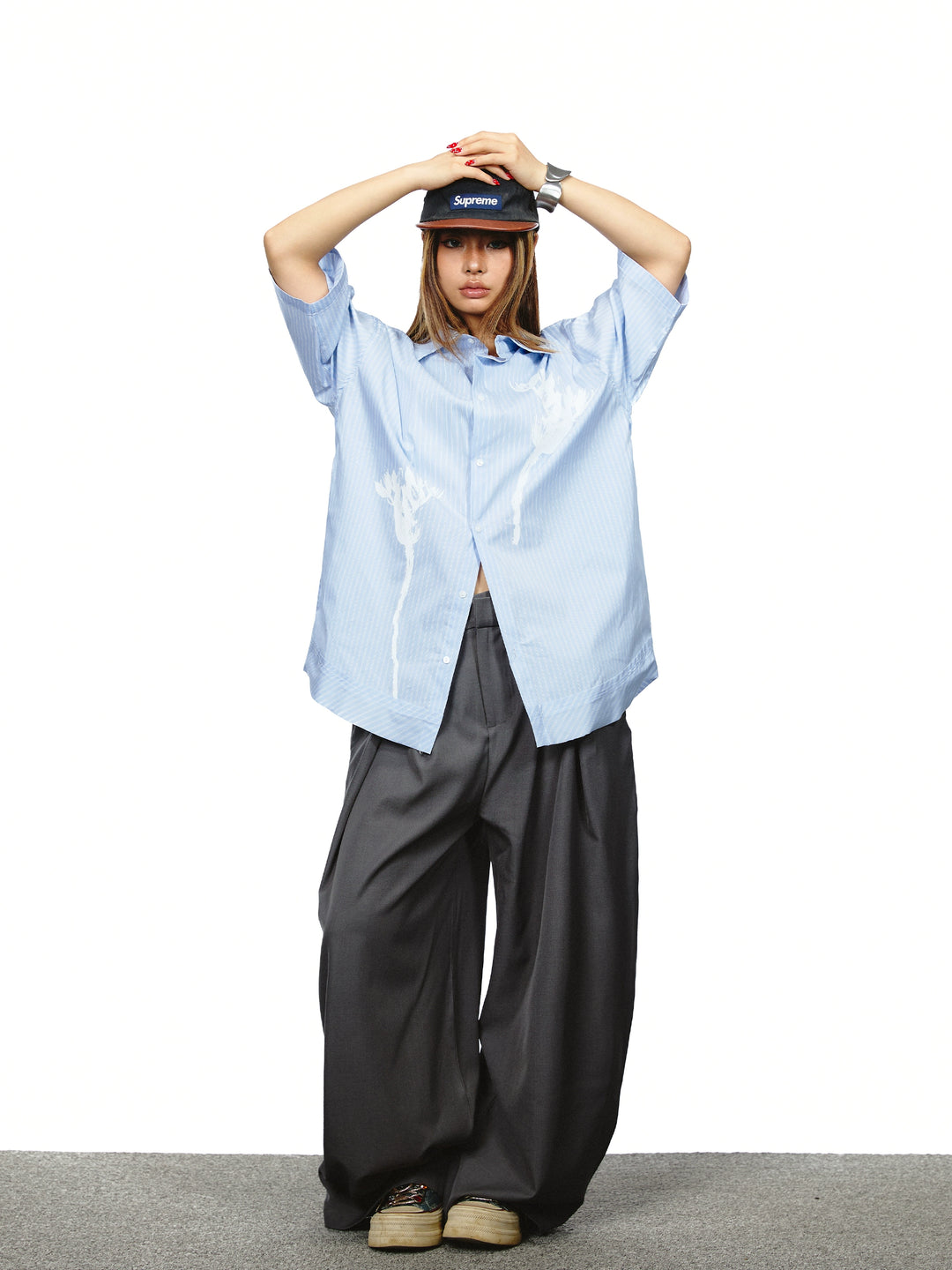 Pantaloni a gamba larga con vita alta plissettata 