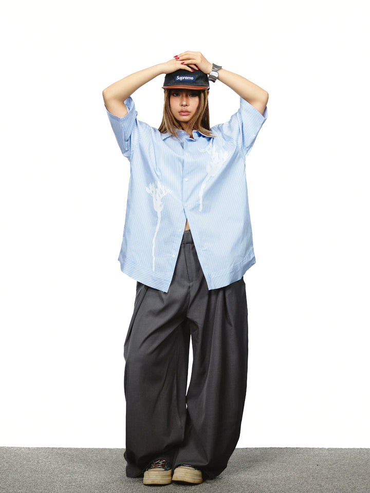 Pantaloni a gamba larga con vita alta plissettata 