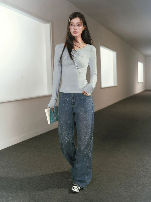 Top de manga larga con cintura ajustable de lana Merino y ribete 