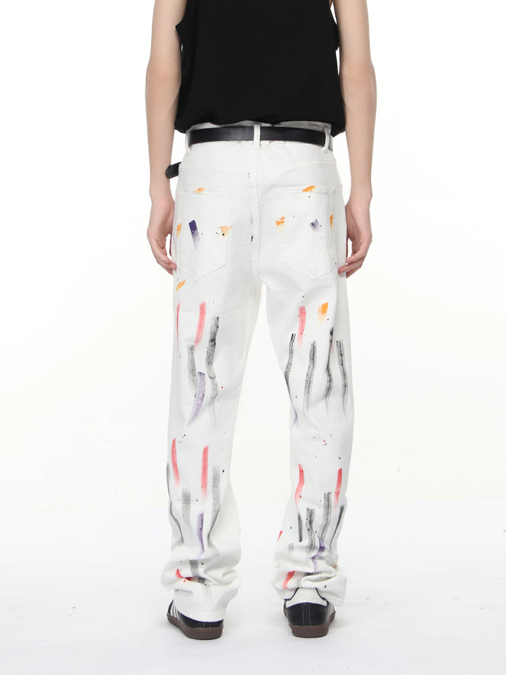 Pantalons droits déchirés en denim graffiti 