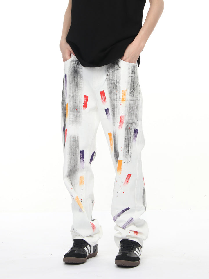 Pantalons droits déchirés en denim graffiti 