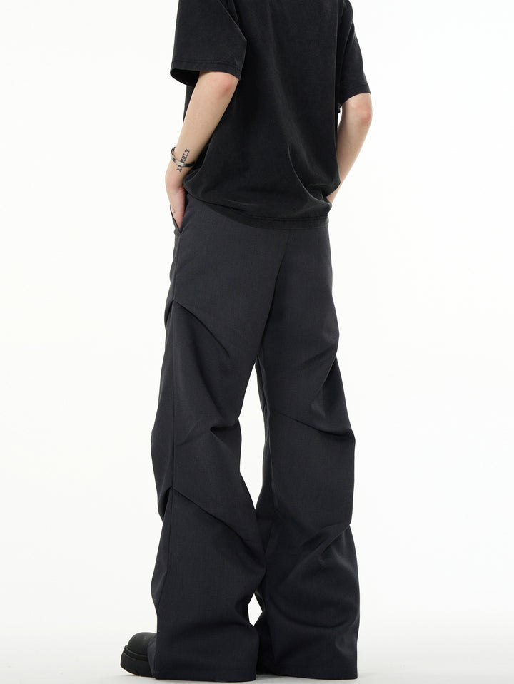 Pantaloni casual a palazzo svasati con pieghe e vestibilità ampia 