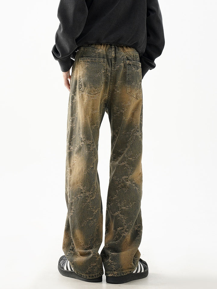 Pantalones de mezclilla acampanados desgastados retro 